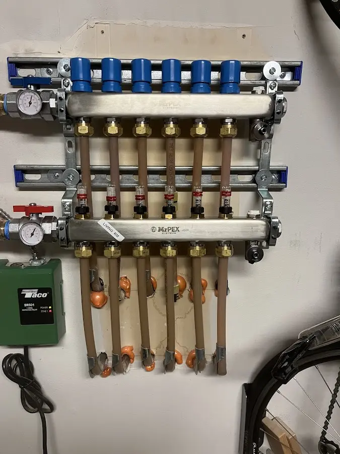 Plumber performing Water Heater Repair at a residential property in Parsons